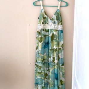 Flowy maxi dress with shades of green and blue and crochet straps and bodice.